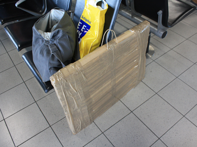 my packing job: recycled box, tons of packing tape, handles from target bag used to fill up empty space in my suitcase on the way over my packing job: recycled box, tons of packing tape, handles from target bag used to fill up empty space in my suitcase on the way over